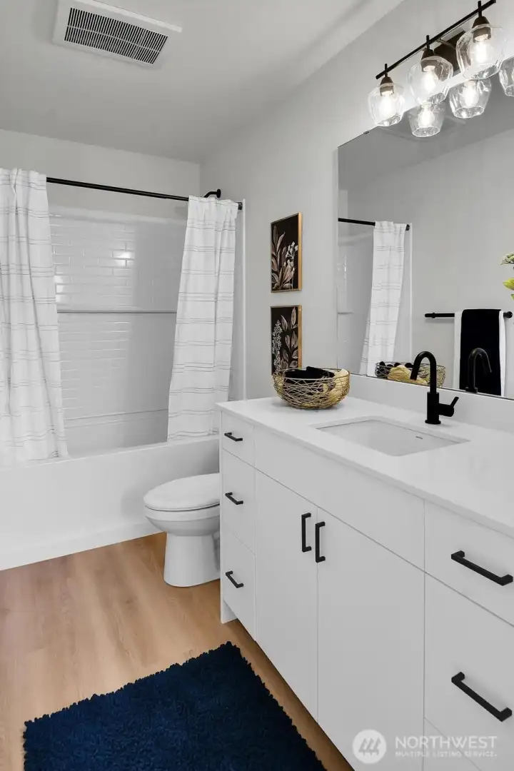 The full bath has lots of storage and serves the secondary bedrooms.