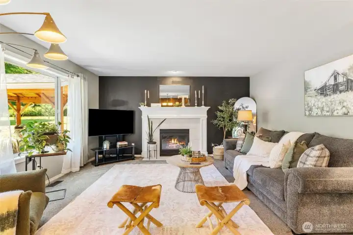 Whether you're hosting friends or enjoying a quiet evening by the fireplace, this spacious living room is made for making memories. Whether you're hosting friends or enjoying a quiet evening by the fireplace, this spacious living room is made for making memories.