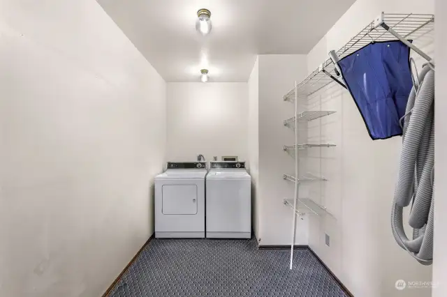 Main floor laundry, located off the garage entry.