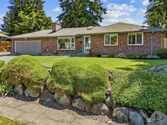 This home's clean lines and well pruned landscaping gives it great curb appeal.