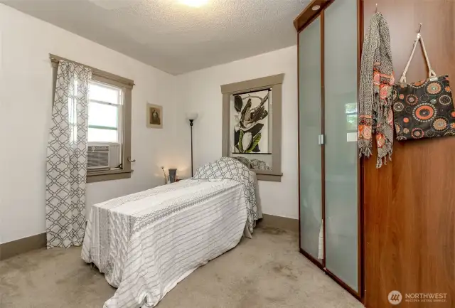 This bedroom has two closets which the second one is movable