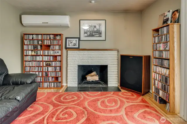 Living Room with Wood Burning Fireplace and Mini Split Air Conditioning