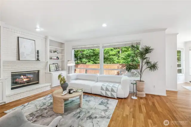 A cozy fireplace in the family room invites relaxation.