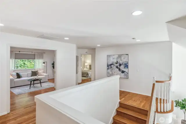 The upper landing with beautiful hardwood floors, 4 bedrooms, plus a bonus room.