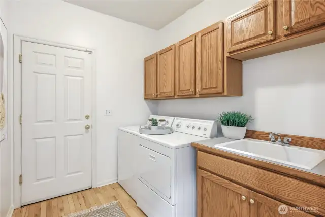 Laundry room with built-ins and convenient sink.