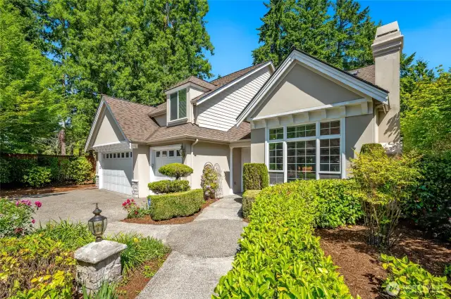 Another view of the front exterior, beautifully landscaped with an inviting walkway that beckons you inside.