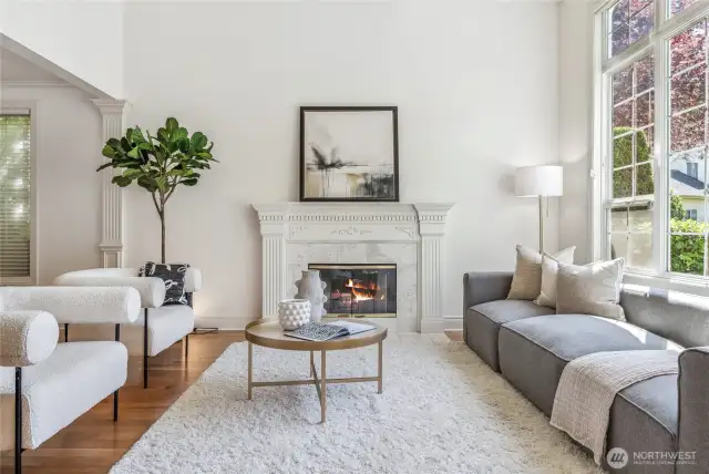 A stunning fireplace adorns the formal living room.