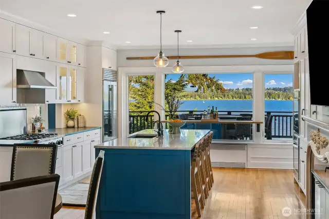 Wonderful chefs kitchen with custom bar and pass through