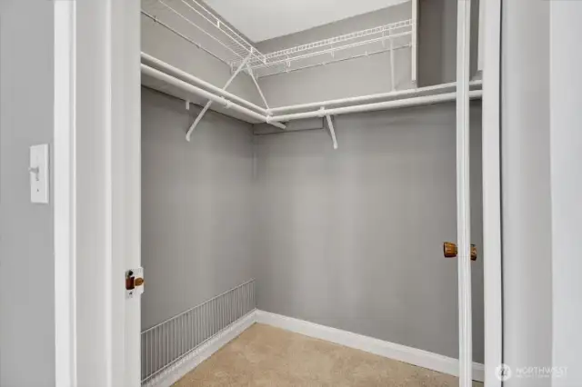Walk in closet in primary bedroom