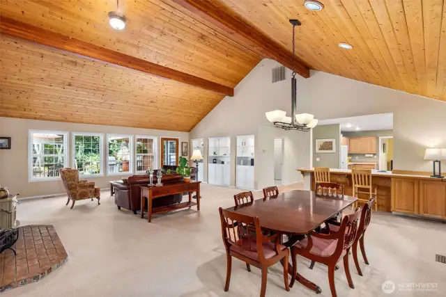 The open concept living/dining room features handsome knotty pine ceilings, 14" at the highest peak.