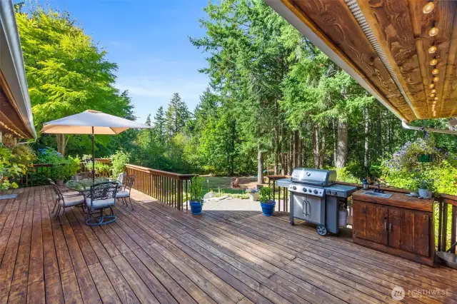 What a great deck! You will spend your summers back here, enjoying BBQs, or just relaxing in the privacy of your own park-like back yard