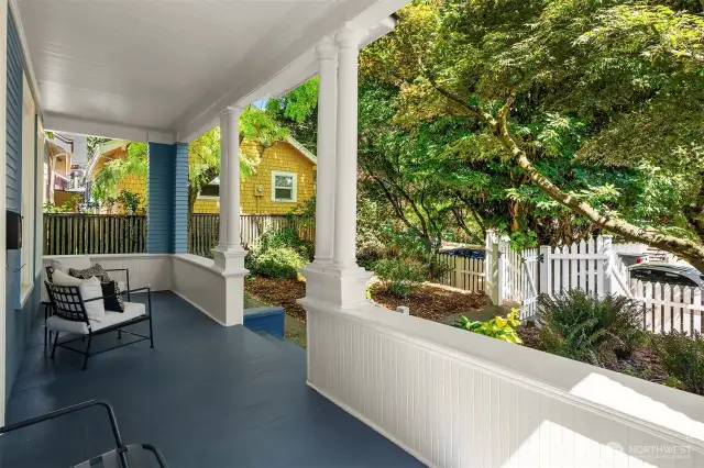 Thoughtfully positioned off the street, this freshly painted home offers a full length, shaded front porch for exceptional outdoor living. Shared driveway to off-street parking to the left/south.
