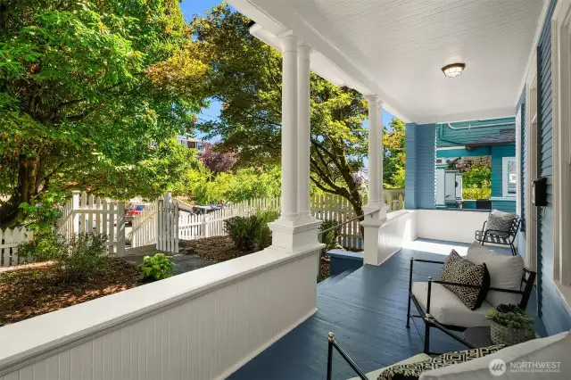 Thoughtfully positioned off the street, this freshly painted home offers a full length, shaded front porch for exceptional outdoor living. Shared driveway to off-street parking to the left/south.