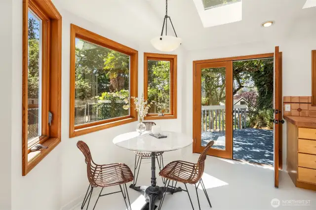 New appliances in the eat in kitchen with French doors leading to the rear garden and raised deck.