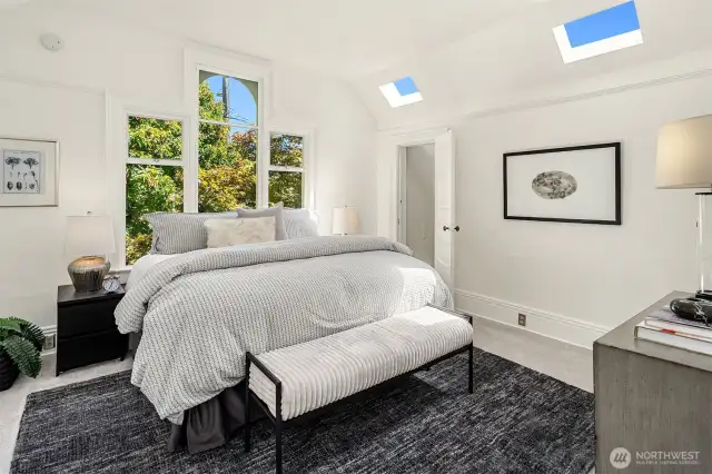 Gorgeous upstairs bedroom with filtered light and 2 closets.