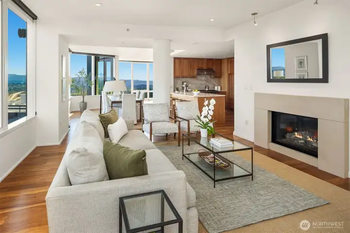 The perfect floor plan.Open living room with designer lighting and sleek gas fireplace.