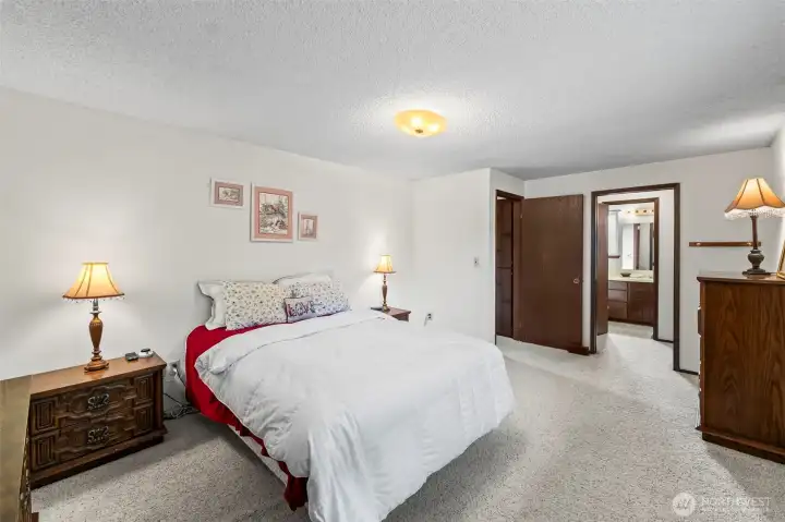 King-sized primary bedroom with personal bathroom.