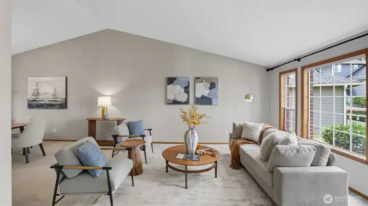 Elegant formal sitting room filled with natural light—perfect for gathering or relaxing.
