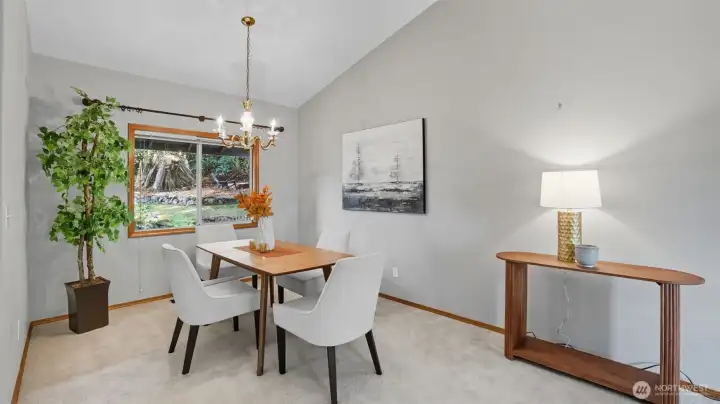 Enjoy any meal this inviting dining room with a serene view of the backyard.