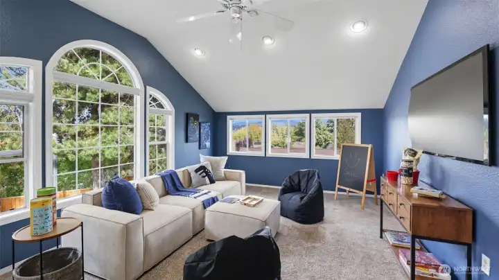 This light-filled bonus room with vaulted ceilings is ideal for entertaining or unwinding.