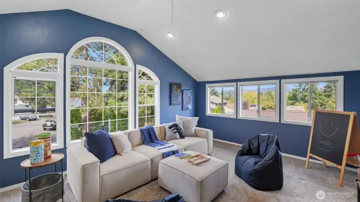 Large windows frame the perfect setting for reading, lounging, or hosting!