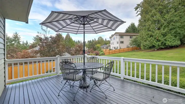 Beautiful deck space offering both relaxation and entertaining potential.