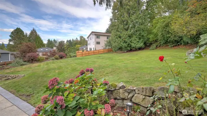 Expansive green space perfect for play, gardening, or quiet relaxation.