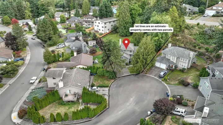 Aerial view showcasing the home and its unique offering of an additional parcel for extra space and possibilities.