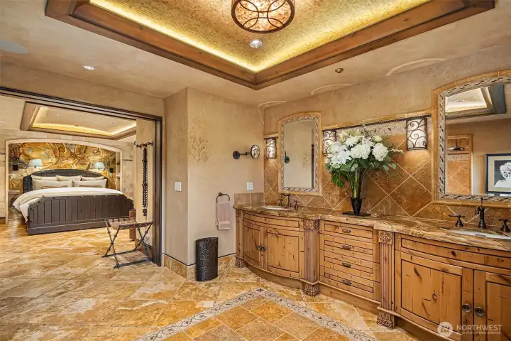 Luxurious bathroom has accessible commode.
