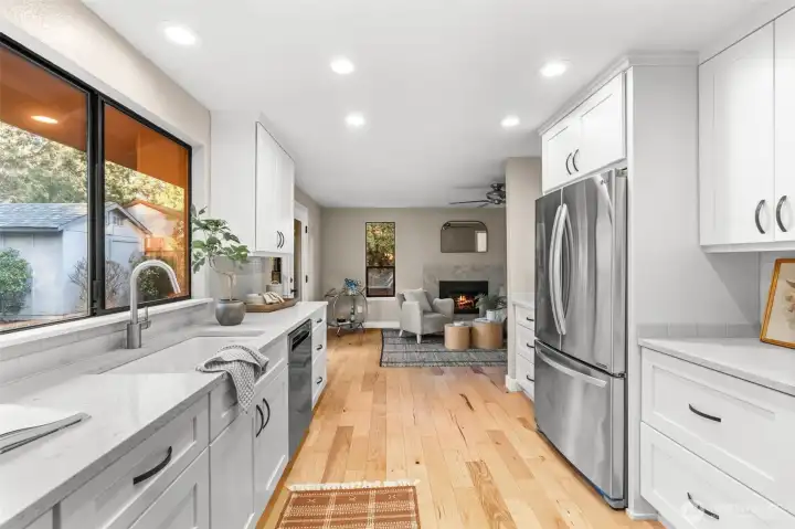 A large window above the kitchen sink offers clear view of backyard activities.
