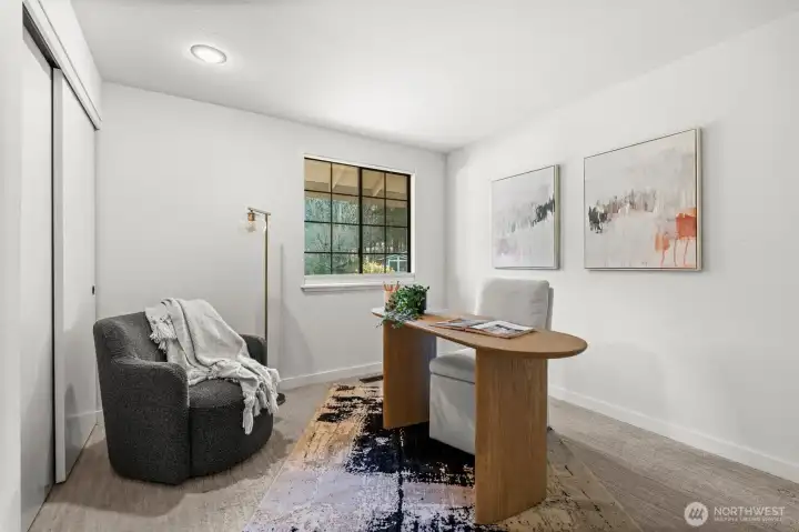 Bedroom featuring ample closet space and fitted carpet flooring, providing comfort and storage convenience.