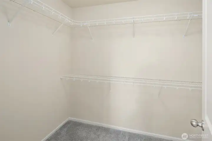 Primary bedroom walk-in closet