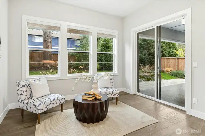 Just off the kitchen, this light-filled nook offers an inviting space for morning coffee, casual dining, or quiet conversation. Large windows and direct access to the covered patio create seamless indoor-outdoor living and effortless flow to the private backyard.
