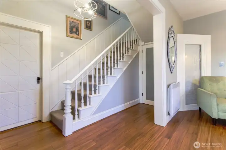 Short term rental possibility with window blinds, door, and sound panels on bedroom door.