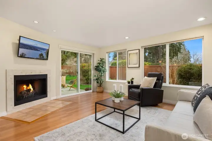 The generous sized living room features a wood-burning fireplace.