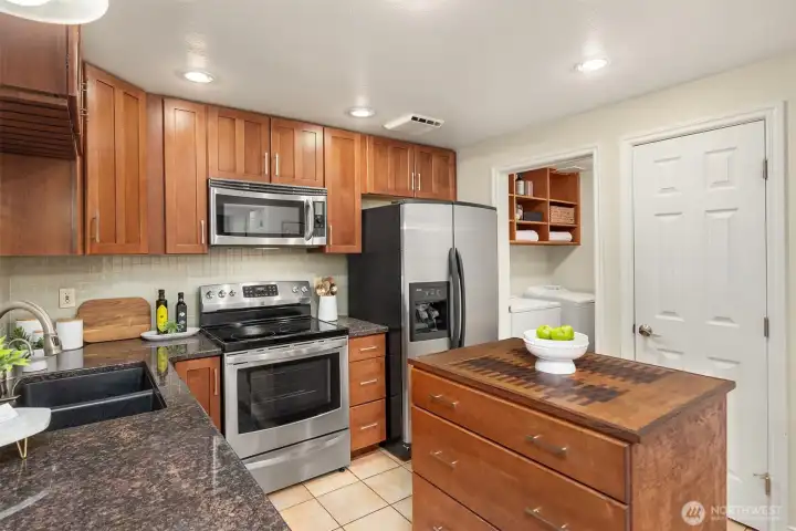 Note the laundry room off the kitchen between the kitchen and garage, additional storage is out of view, which makes this an ideal mudroom/storage area.