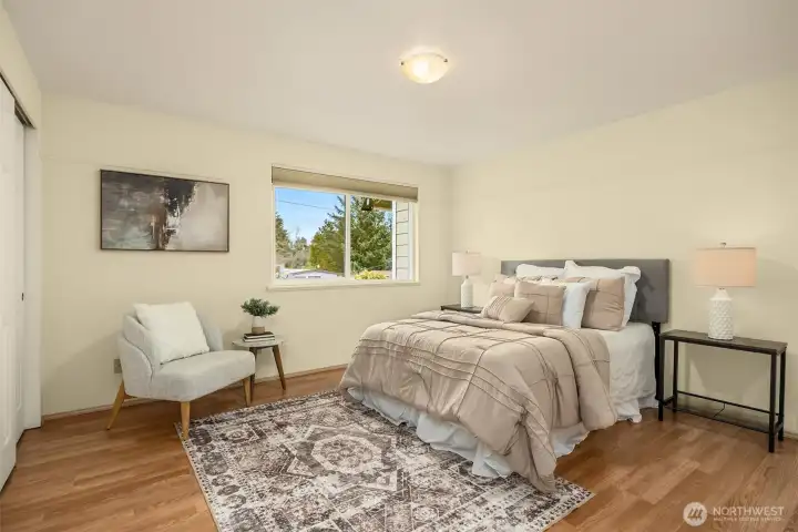 1st of the 2 upper level bedroom with a pleasant outlook