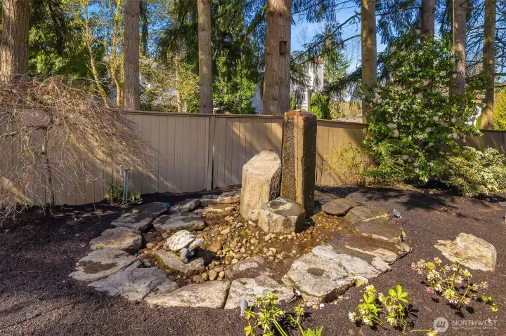 Water Feature Adjacent to Custom Stone Patio