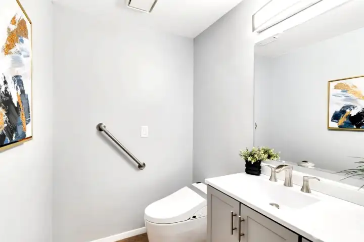 Fully remodeled half bath on main level with new electronic multi feature toilet/bidet, vanity, sink, faucet, etc