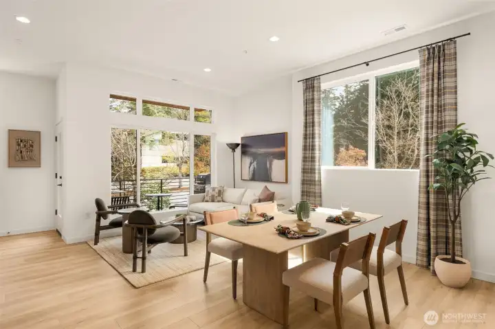 Abundance of windows throughout! Great room floorplan provides opportunity to arrange to suit your style! Photo is of model home of same floorplan.  Color schemes and finishes will vary per plan.
