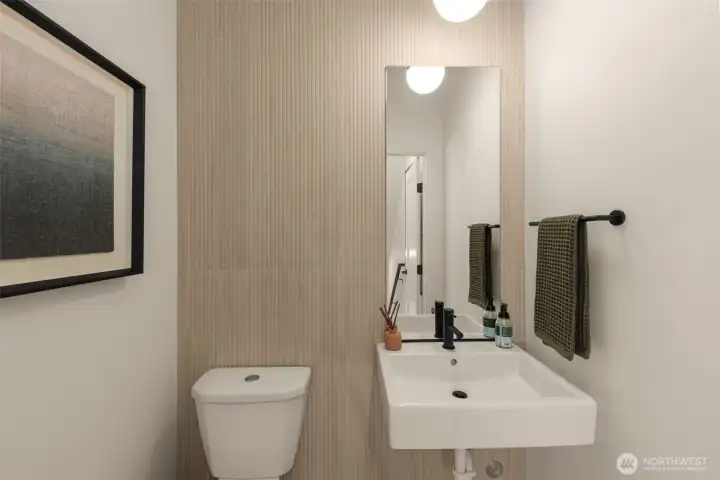 Conveniently located Powder Room. Photo is of model home of same floorplan.  Color schemes and finishes will vary per plan.