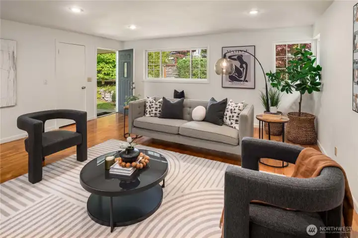 Looking back towards the entry this home features 3 windows, recessed lighting and built-in speakers overhead.
