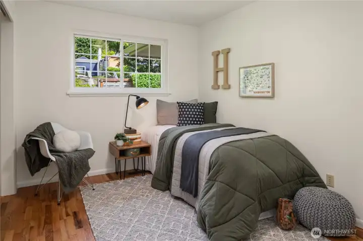 This third bedroom also features a lighted desk area on the right.