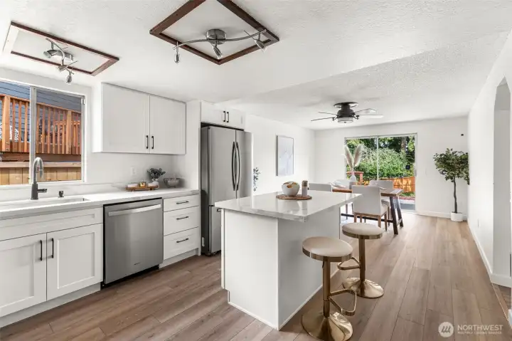 Updated kitchen has an abundance of natural light with eating space. Updated kitchen has an abundance of natural light with eating space.