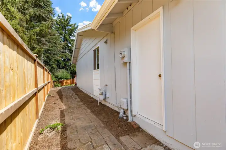 Side entrance from garage to Yard. Side entrance from garage to Yard.