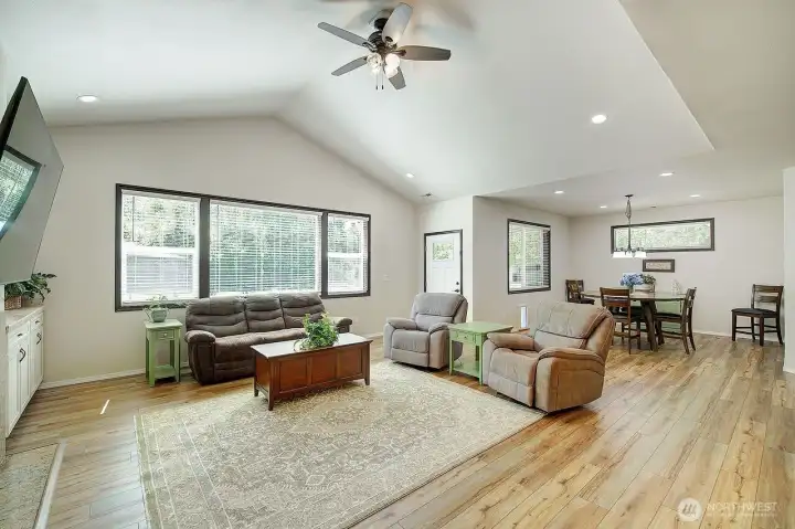 Living room floods with natural light and vaulted ceilings. Living room floods with natural light and vaulted ceilings.