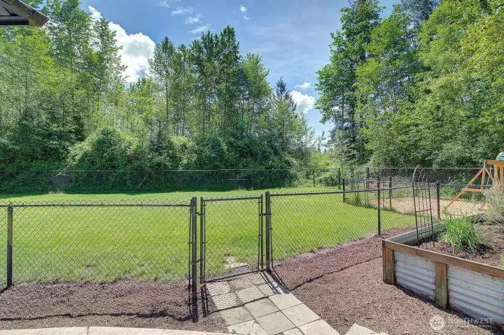 the large fully fenced backyard with double gates on both sides to the front and to the back of the property. Drive all the way around if you need to! the large fully fenced backyard with double gates on both sides to the front and to the back of the property. Drive all the way around if you need to!