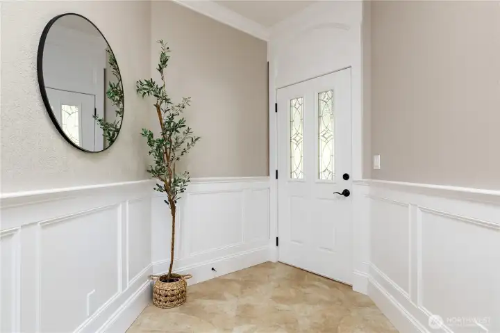 Light-filled entry accented with classic wainscoting Light-filled entry accented with classic wainscoting