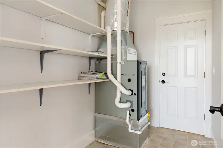 Lower level features newer furnace and tankless hot water plus huge storage area Lower level features newer furnace and tankless hot water plus huge storage area
