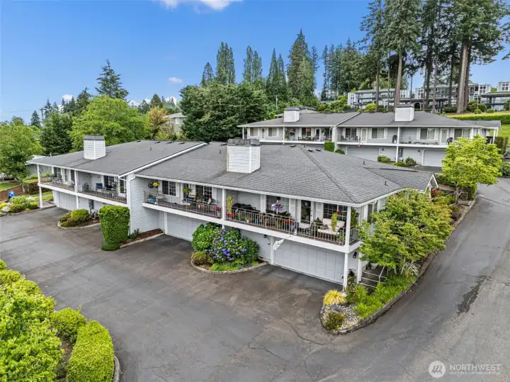 This condo unit is the second from the right, easily identifiable by the distinctive yellow hanging basket displayed on the front deck.